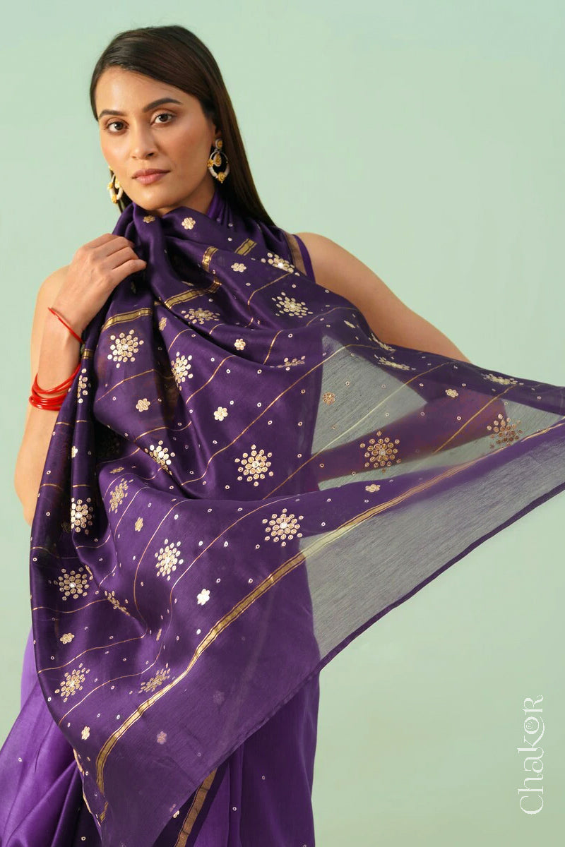 Front close view of violet purple shaded Chanderi silk cotton saree showing woven body and embroidered details.
