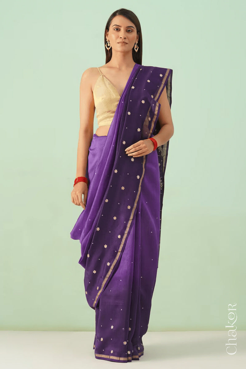 Full-length view of violet purple shaded Chanderi silk cotton saree with ombre effect and tissue-striped pallu.

