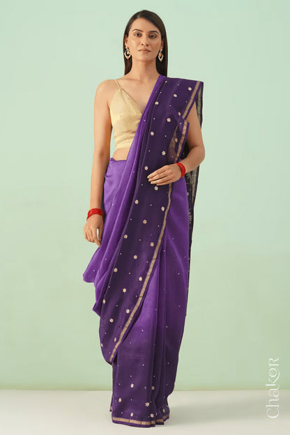 Full-length view of violet purple shaded Chanderi silk cotton saree with ombre effect and tissue-striped pallu.
