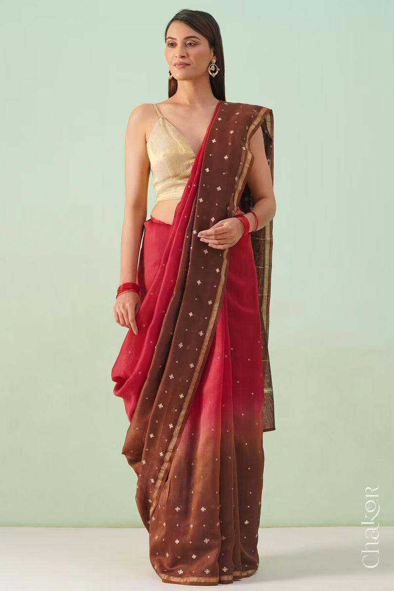 Full-length view of red brown shaded Chanderi silk cotton saree with ombre effect and tissue-striped pallu.
