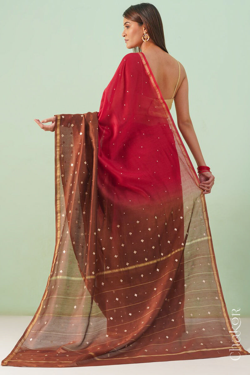 Back view of red brown shaded Chanderi silk cotton saree displaying ombre dyeing and tissue pallu.
