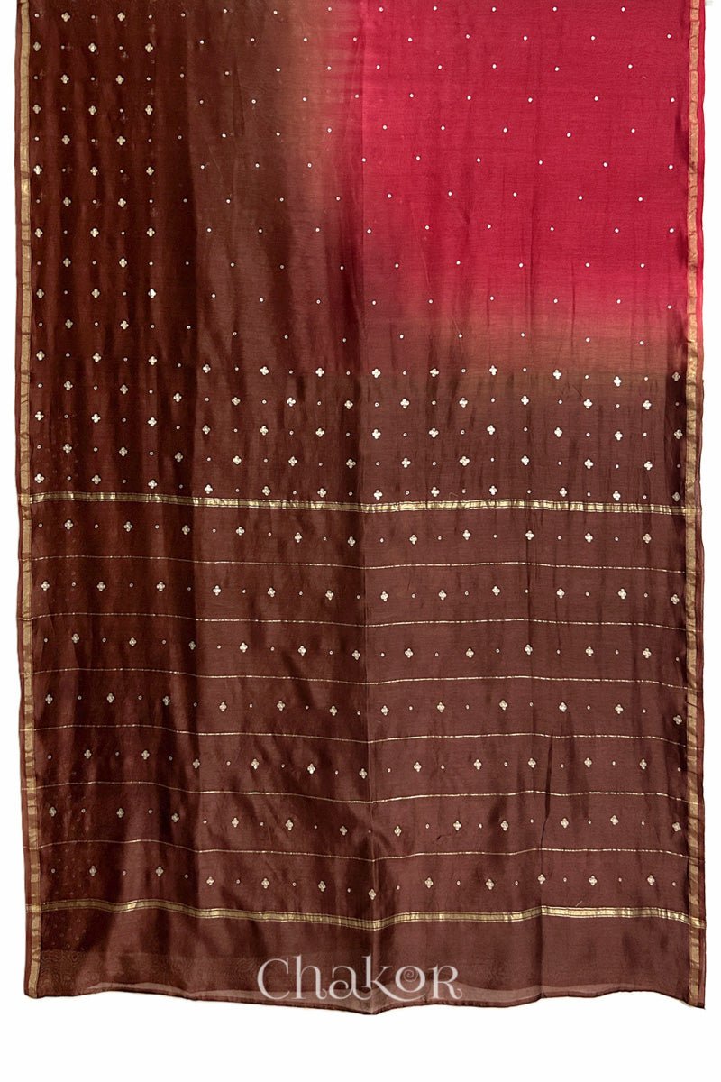 Flat view of red brown shaded Chanderi silk cotton saree showing ombre transition and border finish.
