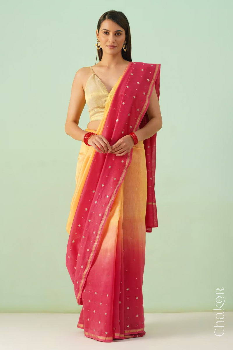 Full-length view of yellow pink shaded Chanderi silk cotton saree with ombre effect and tissue-striped pallu.
