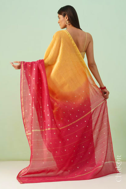 Back view of yellow pink shaded Chanderi silk cotton saree displaying ombre dyeing and tissue pallu.

