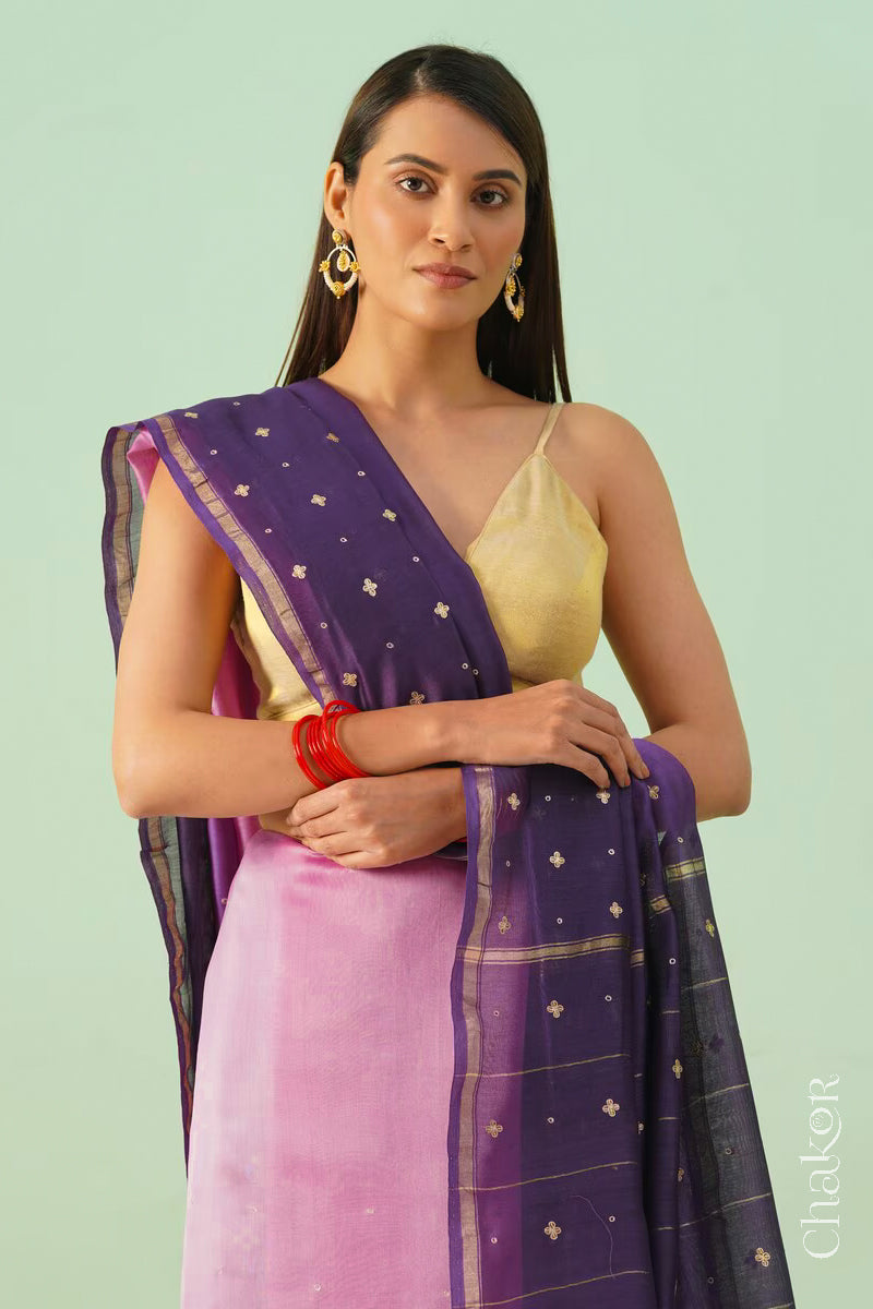 Front close view of pink purple shaded Chanderi silk cotton saree showing woven body and embroidered details.
