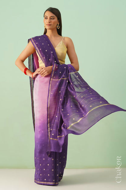 Model wearing a pink purple shaded Chanderi silk cotton saree with hand-embroidered sequin and zari details.
