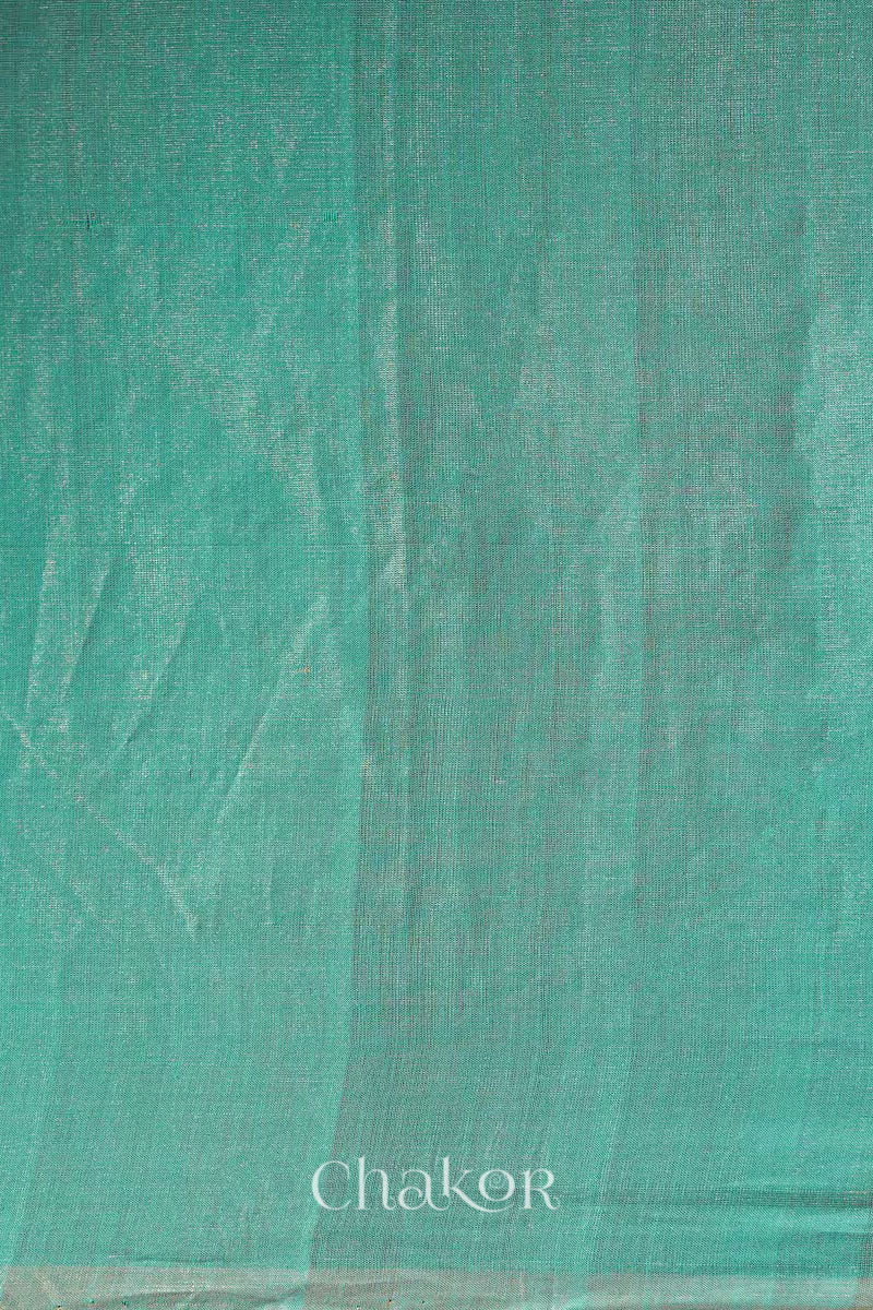 Flatshot of peacock blue Chanderi tissue silk cotton saree showing woven tissue texture.
