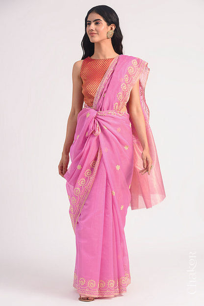 Full-length view of pink Chanderi silk cotton saree draped to show handloom texture and embroidery.

