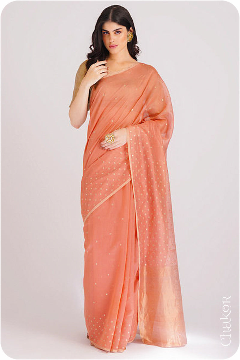 Chakor's Peach Handloom Silk Cotton Saree with woven tissue pallu & delicate sequin work buttis.