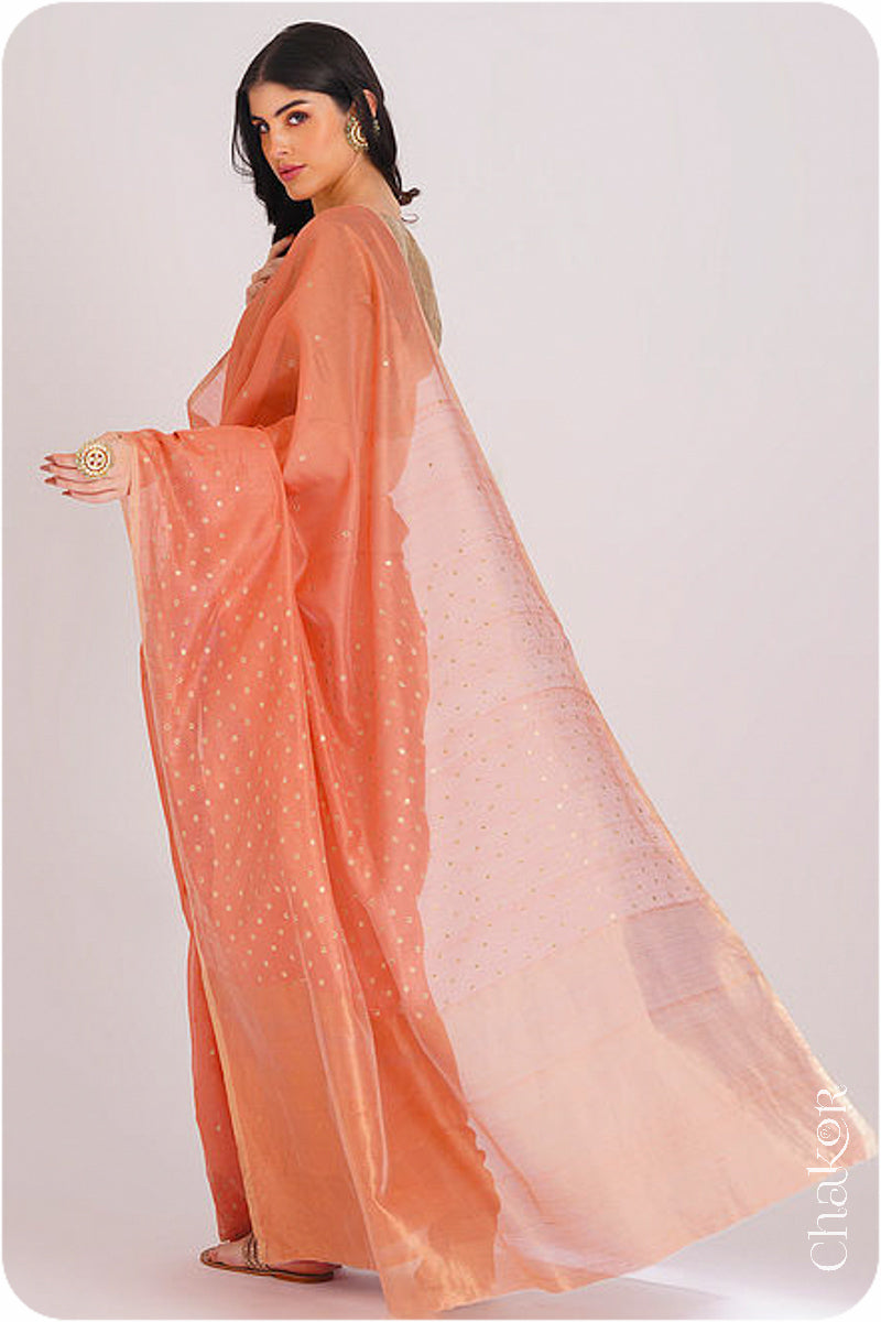 Chakor's Peach Handloom Silk Cotton Saree with woven tissue pallu & delicate sequin work buttis.