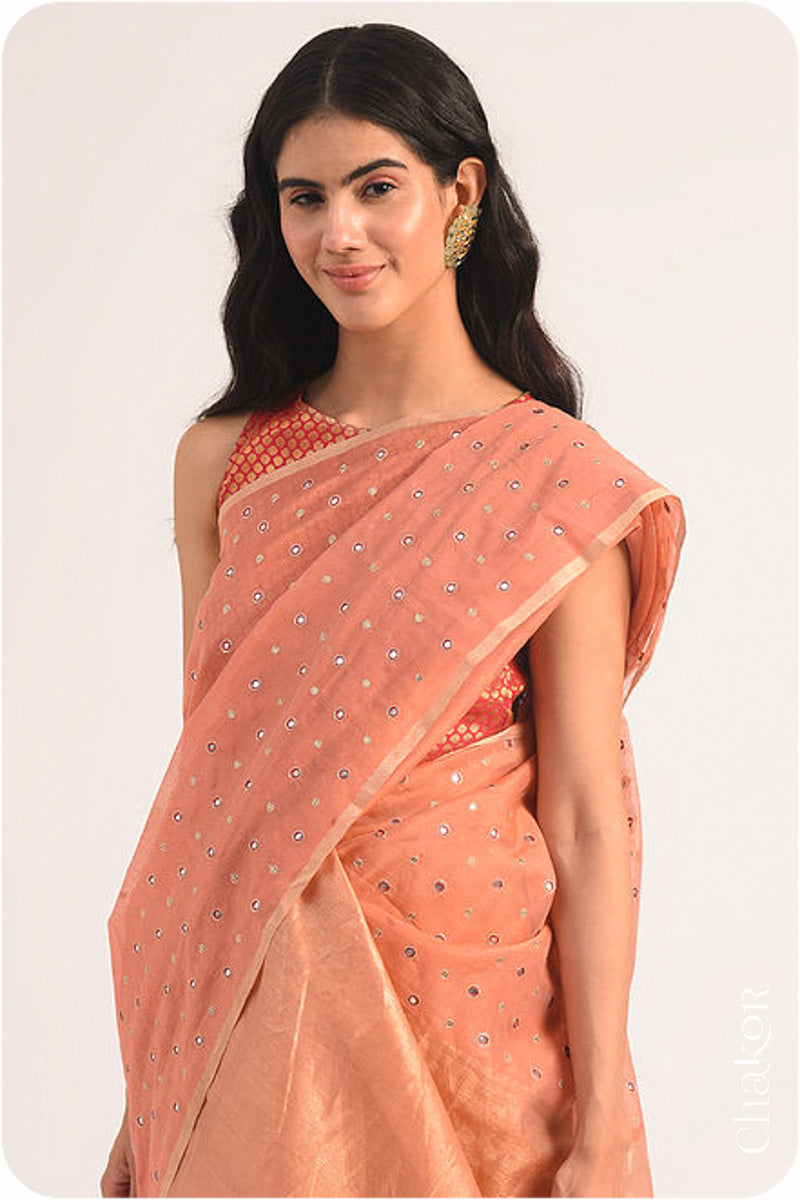 Chakor's Rust Handloom Silk Cotton Saree with woven tissue pallu & delicate mirror & sequin work buttis.