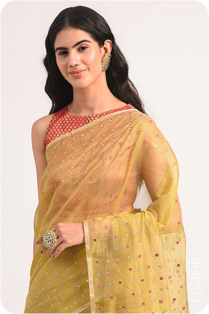 Chakor's Mustard Handloom Silk Cotton Saree with woven tissue pallu & delicate mirror & sequin work buttis.