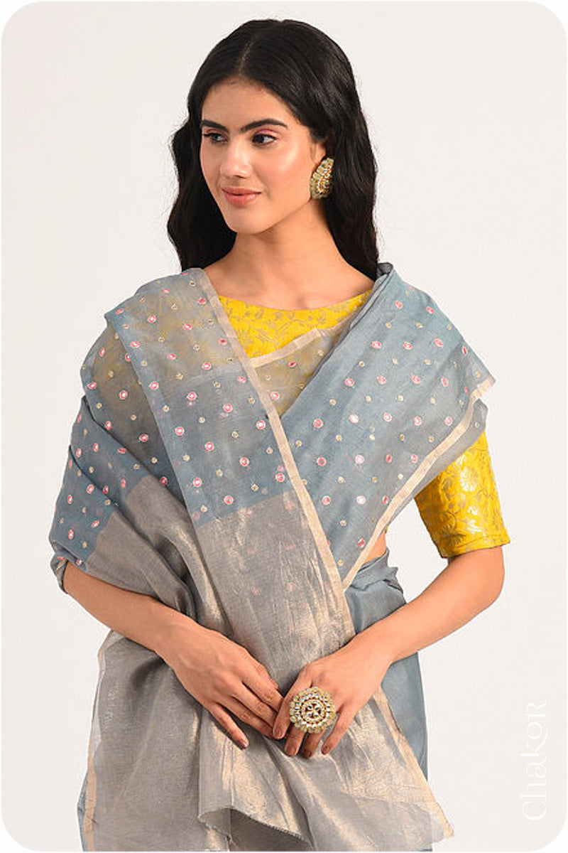 Chakor's Grey Handloom Silk Cotton Saree with woven tissue pallu & delicate mirror & sequin work buttis.