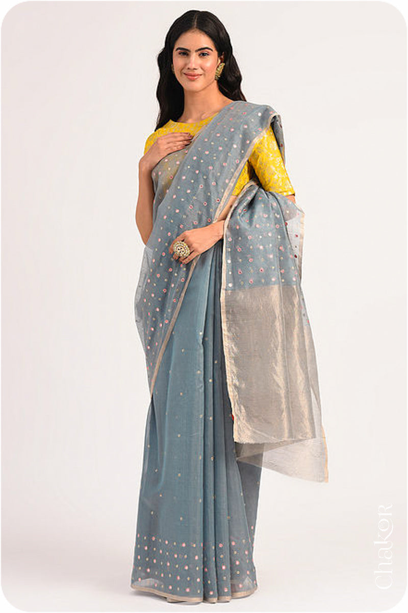 Chakor's Grey Handloom Silk Cotton Saree with woven tissue pallu & delicate mirror & sequin work buttis.