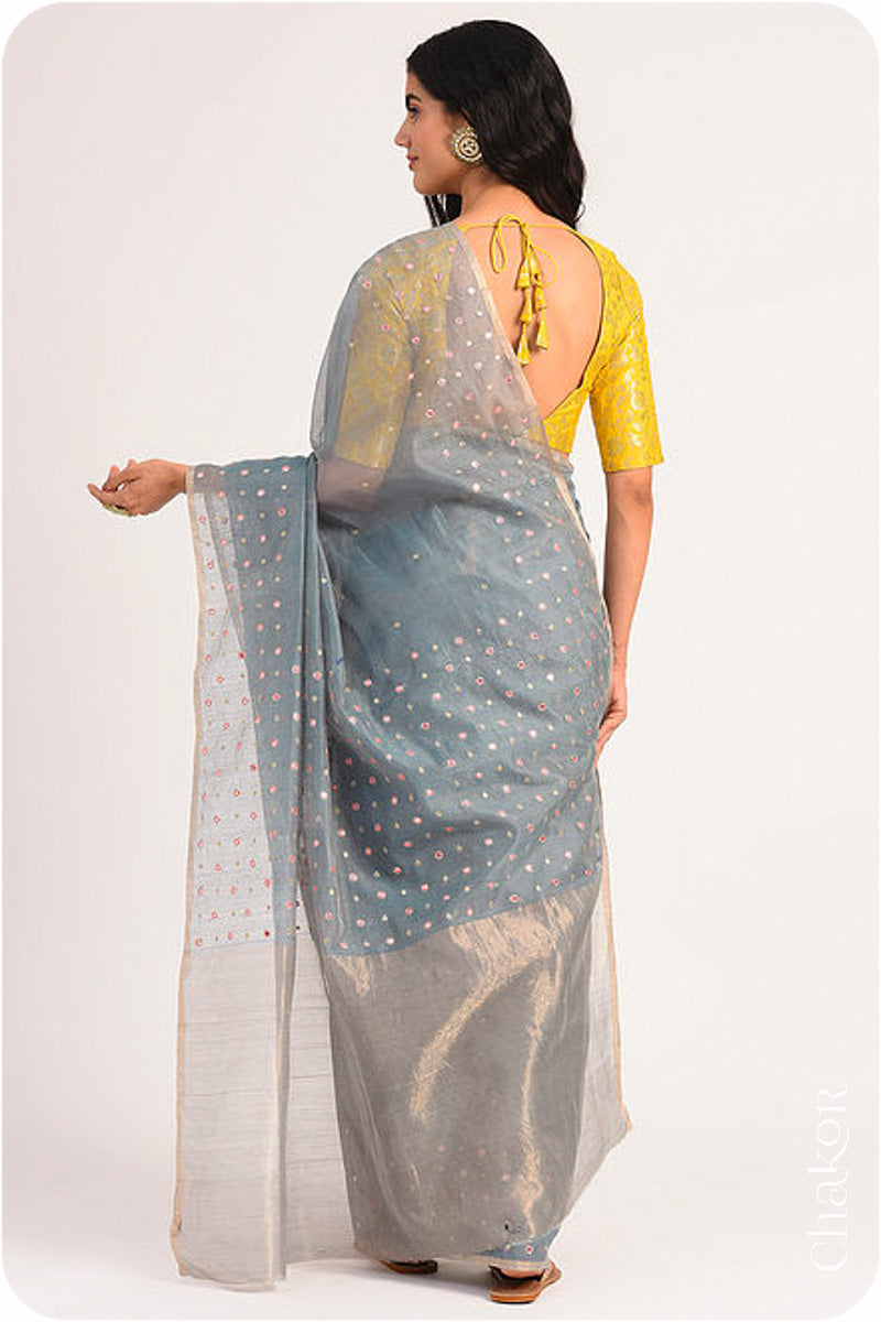 Chakor's Grey Handloom Silk Cotton Saree with woven tissue pallu & delicate mirror & sequin work buttis.