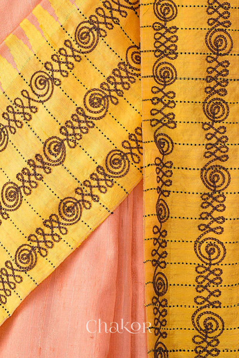 Close up of Peach Yellow Raw Tussar silk handloom saree with Yellow border and detailed with aari embroidery