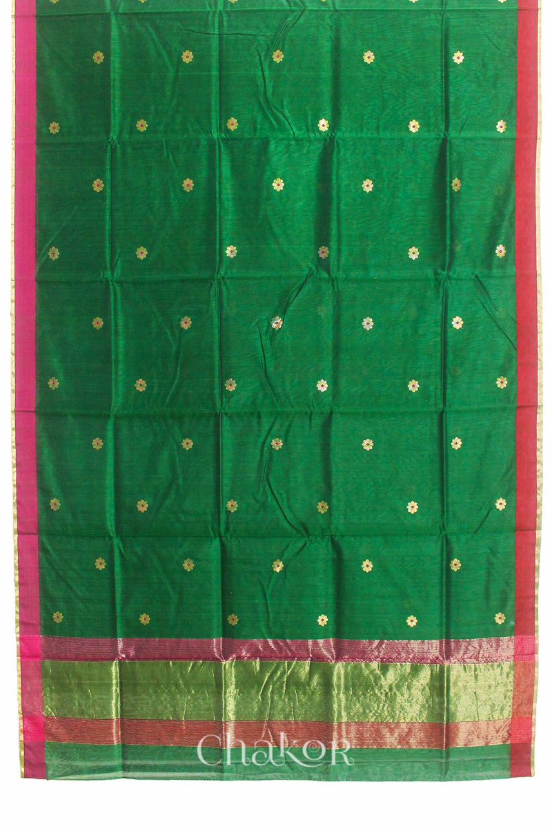 Flatshot of green Chanderi silk cotton saree showing phool butti motifs and contrasting borders.
