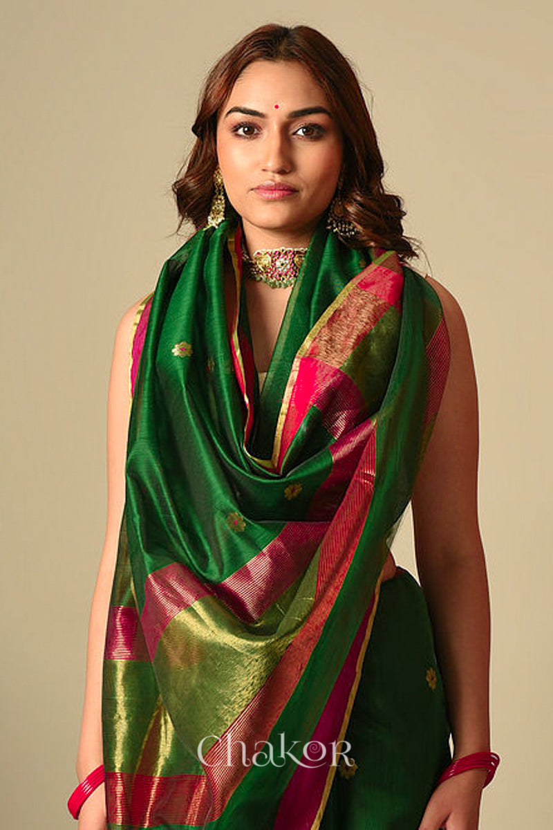 Model wearing Green Chanderi silk cotton saree draped to show Ganga Jamuna borders and woven phool butti motifs.
