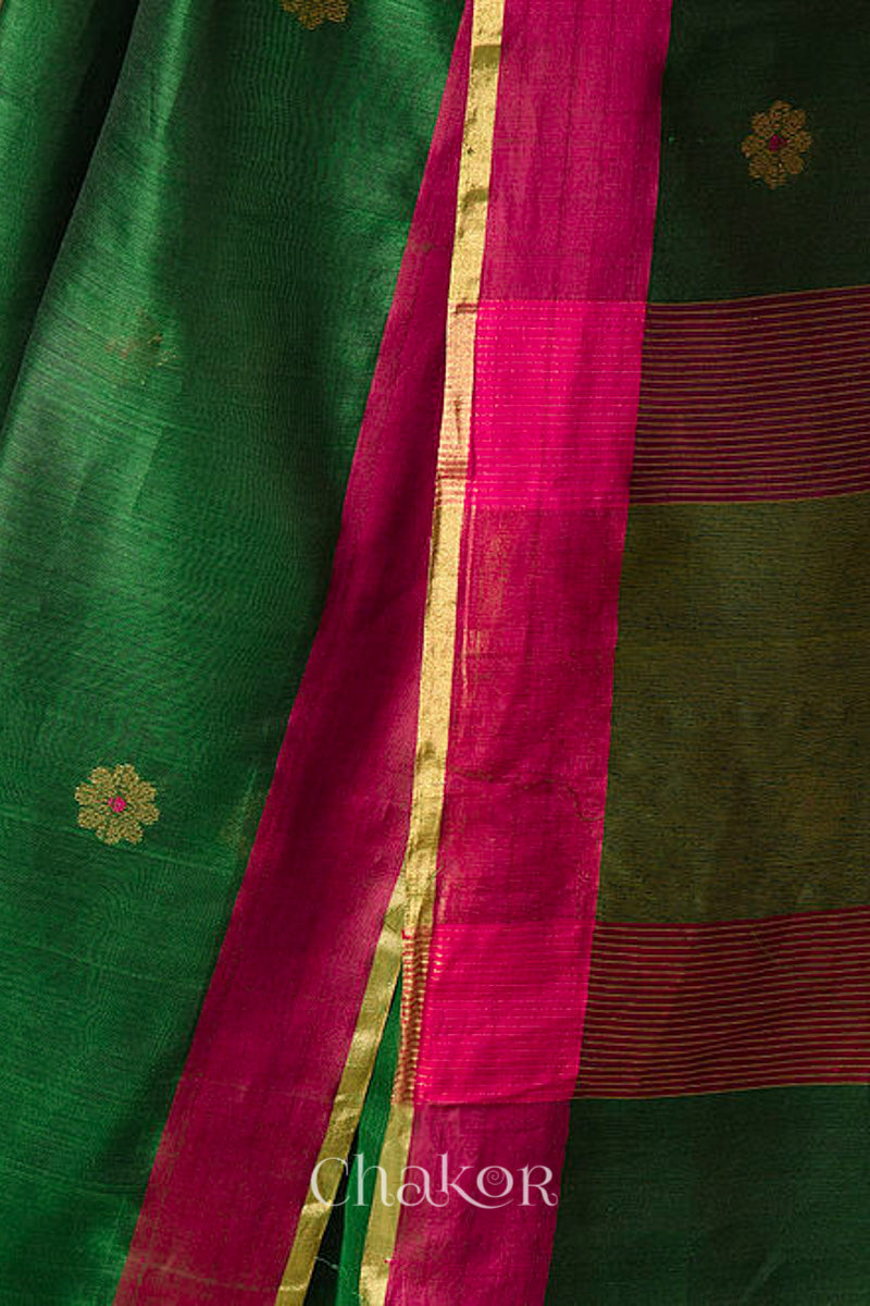 Close-up of Ganga Jamuna border and phool butti weave on green Chanderi silk cotton fabric.
