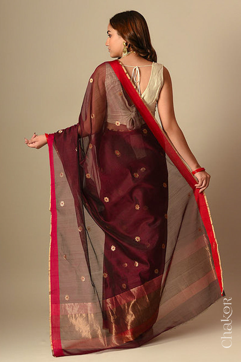 Back view of model wearing Maroon Chanderi silk cotton saree with tissue-striped pallu displayed.
