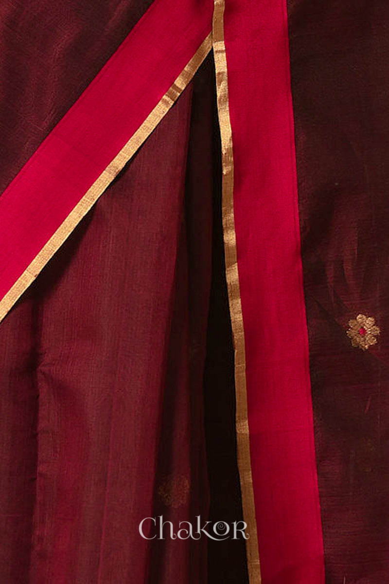 Close-up of Ganga Jamuna border and phool butti weave on Maroon Chanderi silk cotton fabric.
