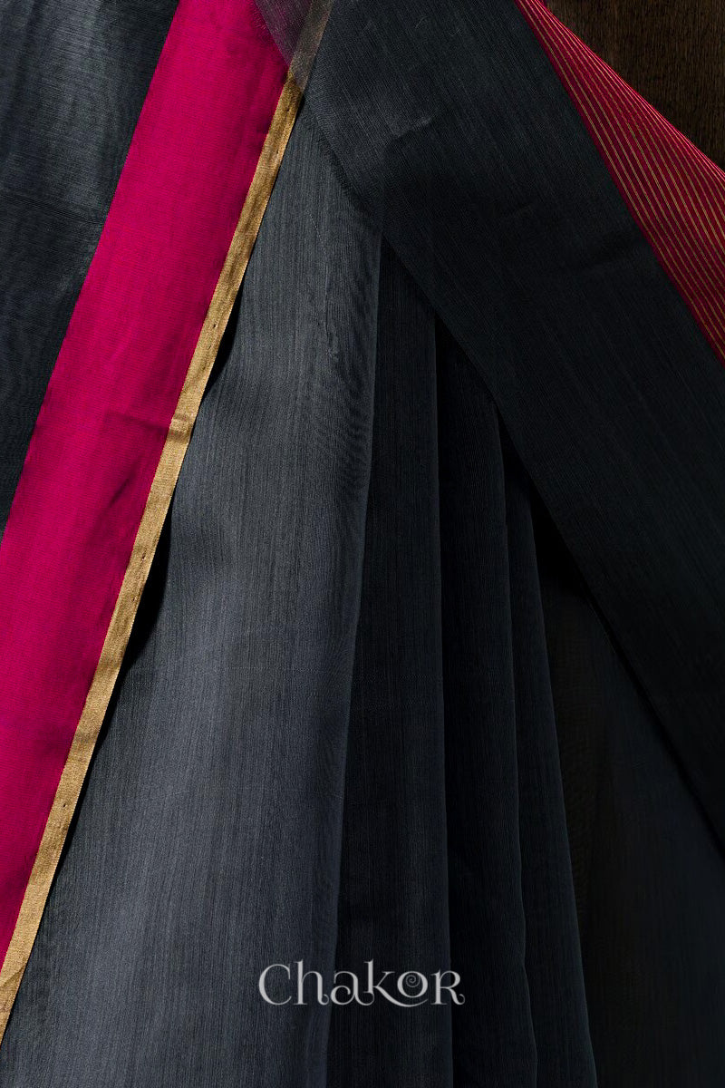 Handwoven Black Chanderi silk cotton saree with tissue pallu displayed pleats view and border closeup.
