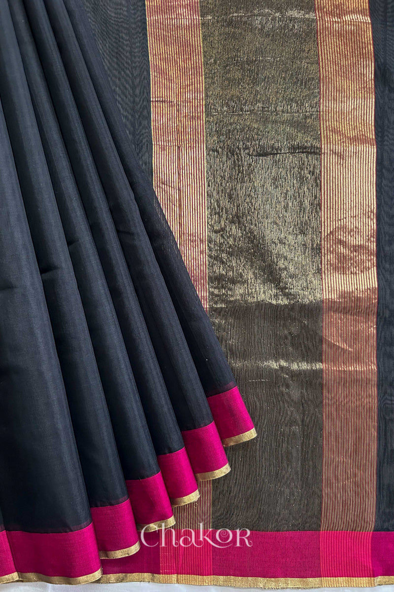 Flatshot of pleats on a Black Chanderi silk cotton saree showing the woven pattern and soft drape.
