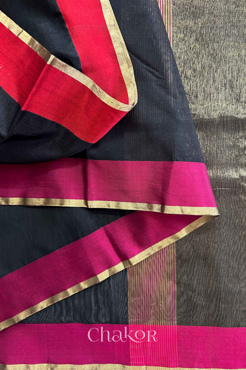 Close-up of the woven texture of Black Chanderi silk cotton fabric.
