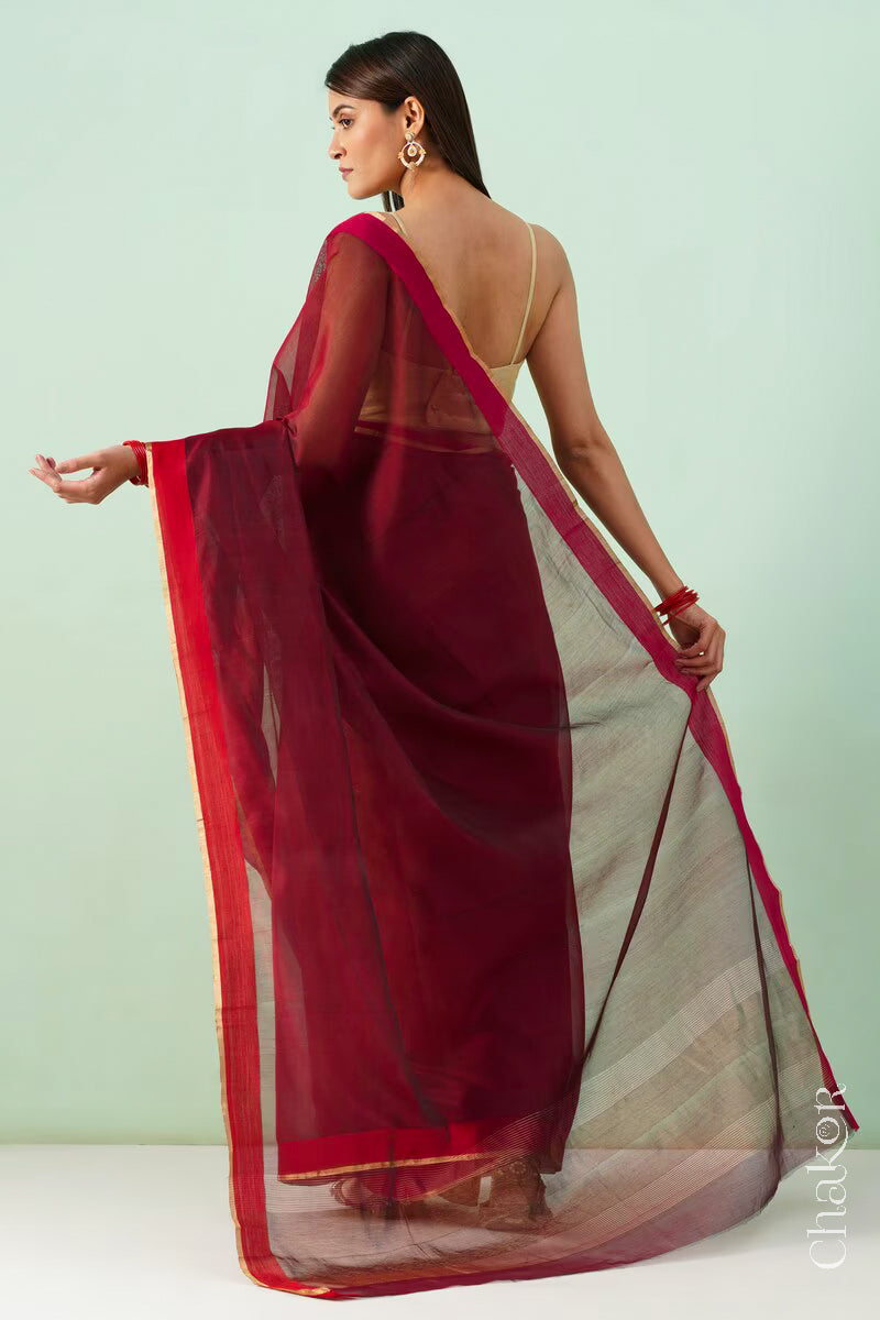 Handwoven Maroon Chanderi silk cotton saree with tissue pallu displayed from the back.
