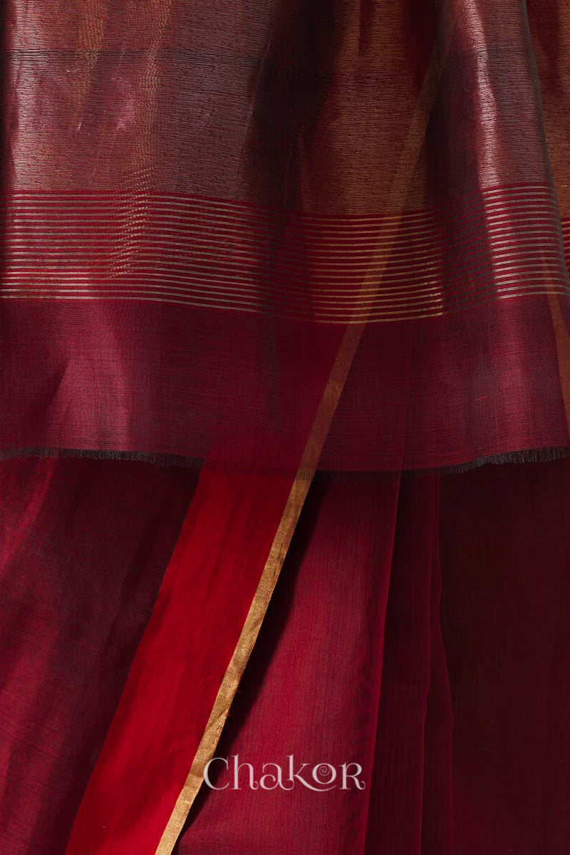 Handwoven Maroon Chanderi silk cotton saree with tissue pallu displayed pleats view and border closeup.
