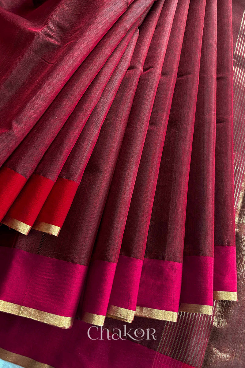 Detail of Ganga Jamuna borders woven with zari on a Maroon Chanderi silk cotton saree.
