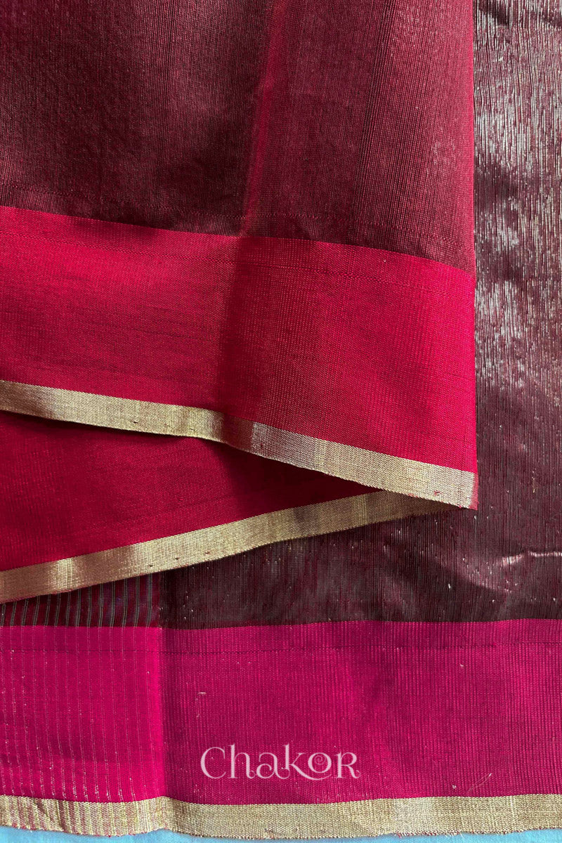 Close-up of the woven texture of Maroon Chanderi silk cotton fabric.
