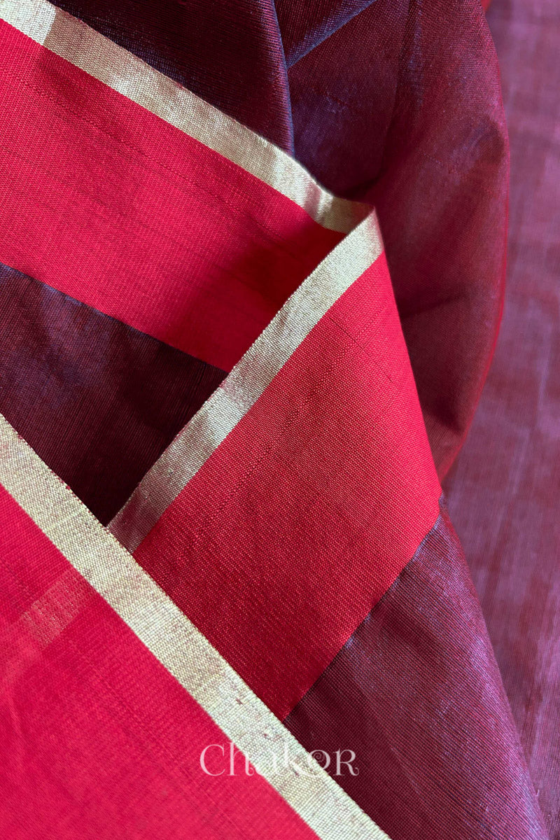 Close-up of the woven texture of Maroon Chanderi silk cotton fabric.
