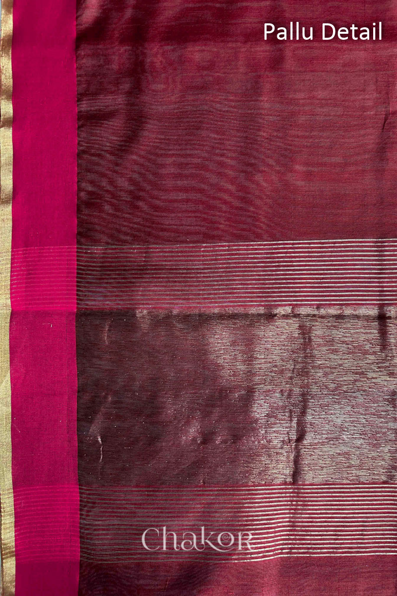 Close-up of the tissue pallu on a Maroon Chanderi silk cotton saree, showing the woven texture.
