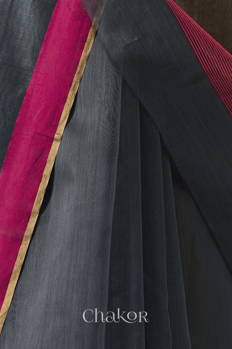 Handwoven Grey Chanderi silk cotton saree with tissue pallu displayed pleats view and border closeup.
