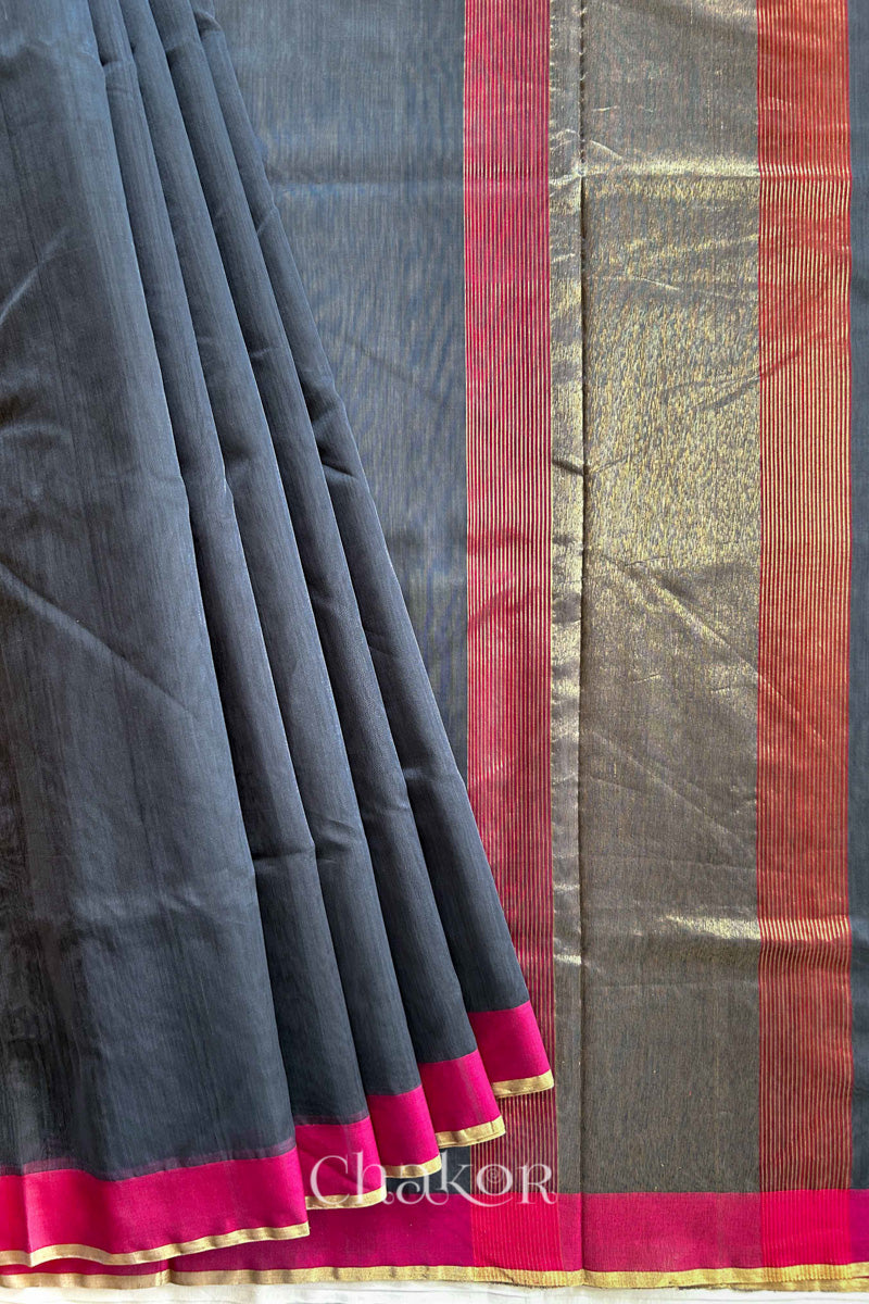 Flatshot of pleats on a Grey Chanderi silk cotton saree showing the woven pattern and soft drape.
