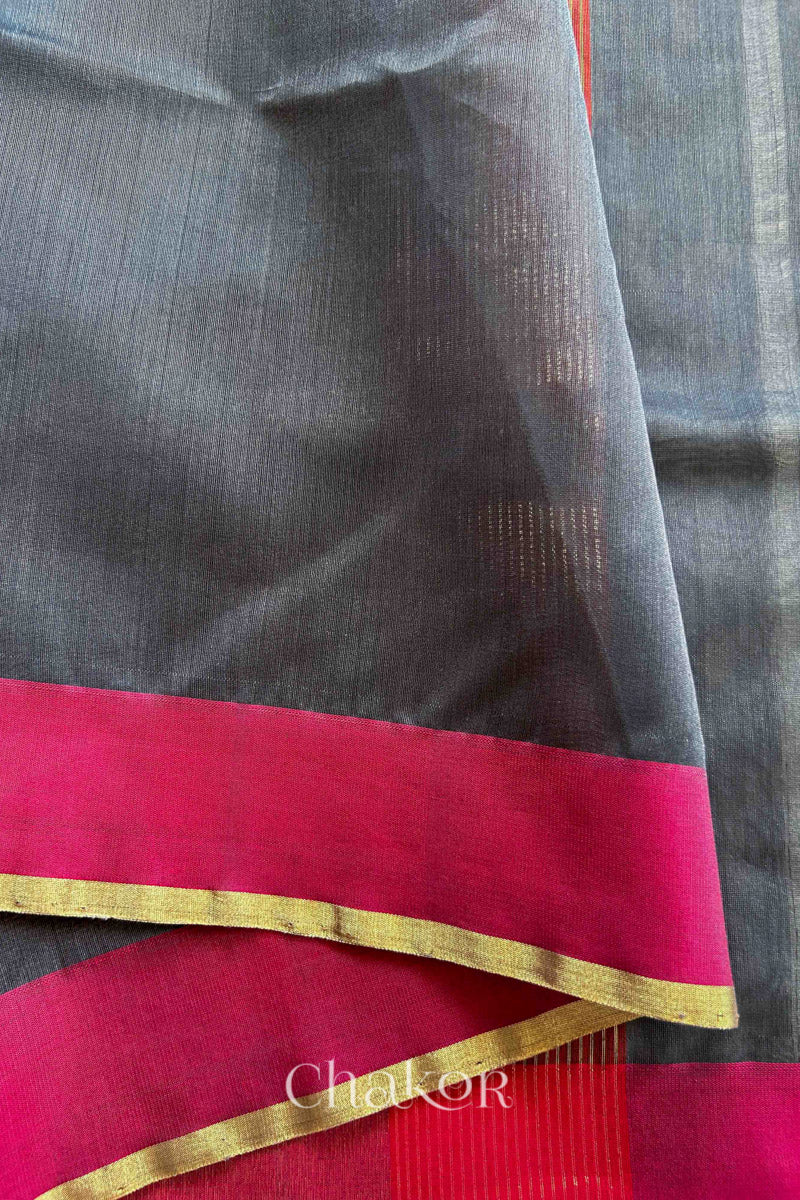 Close-up of the woven texture of Grey Chanderi silk cotton fabric.
