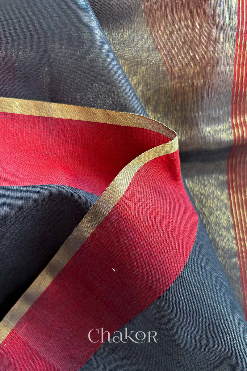 Close-up of the woven texture of Grey Chanderi silk cotton fabric.
