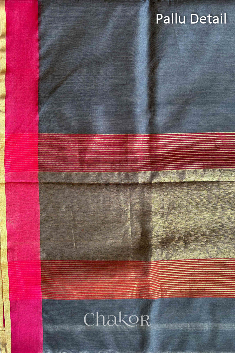 Close-up of the tissue pallu on a Grey Chanderi silk cotton saree, showing the woven texture.
