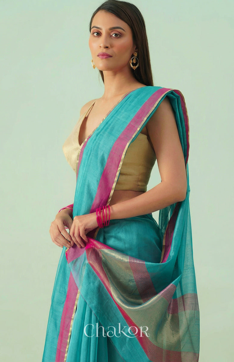 Woman wearing Handloom Sea Blue Chanderi Silk Cotton Saree with ganga jamuna borders and tissue pallu.