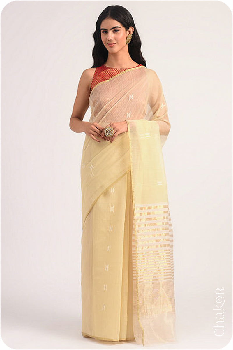 Chakor's Cream Handloom Silk Cotton Saree with woven tissue pallu & delicate buttis.