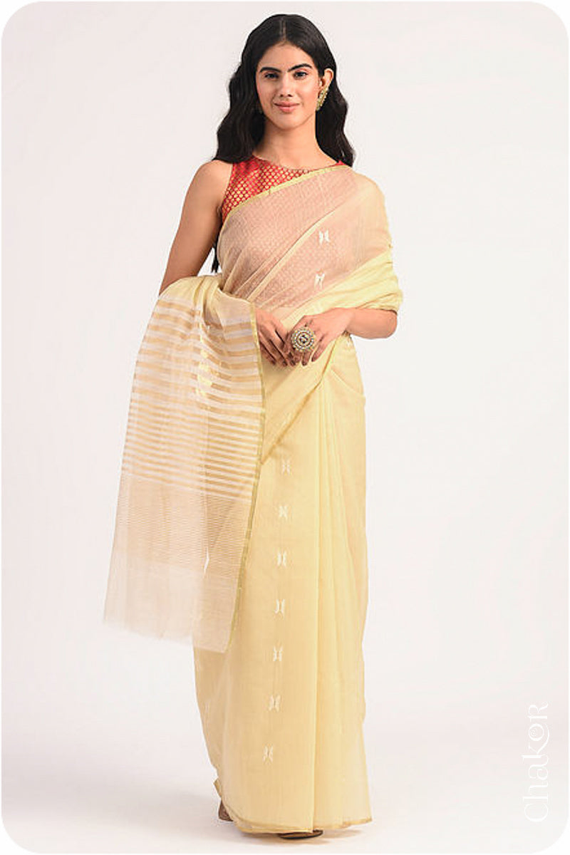 Chakor's Cream Handloom Silk Cotton Saree with woven tissue pallu & delicate buttis.