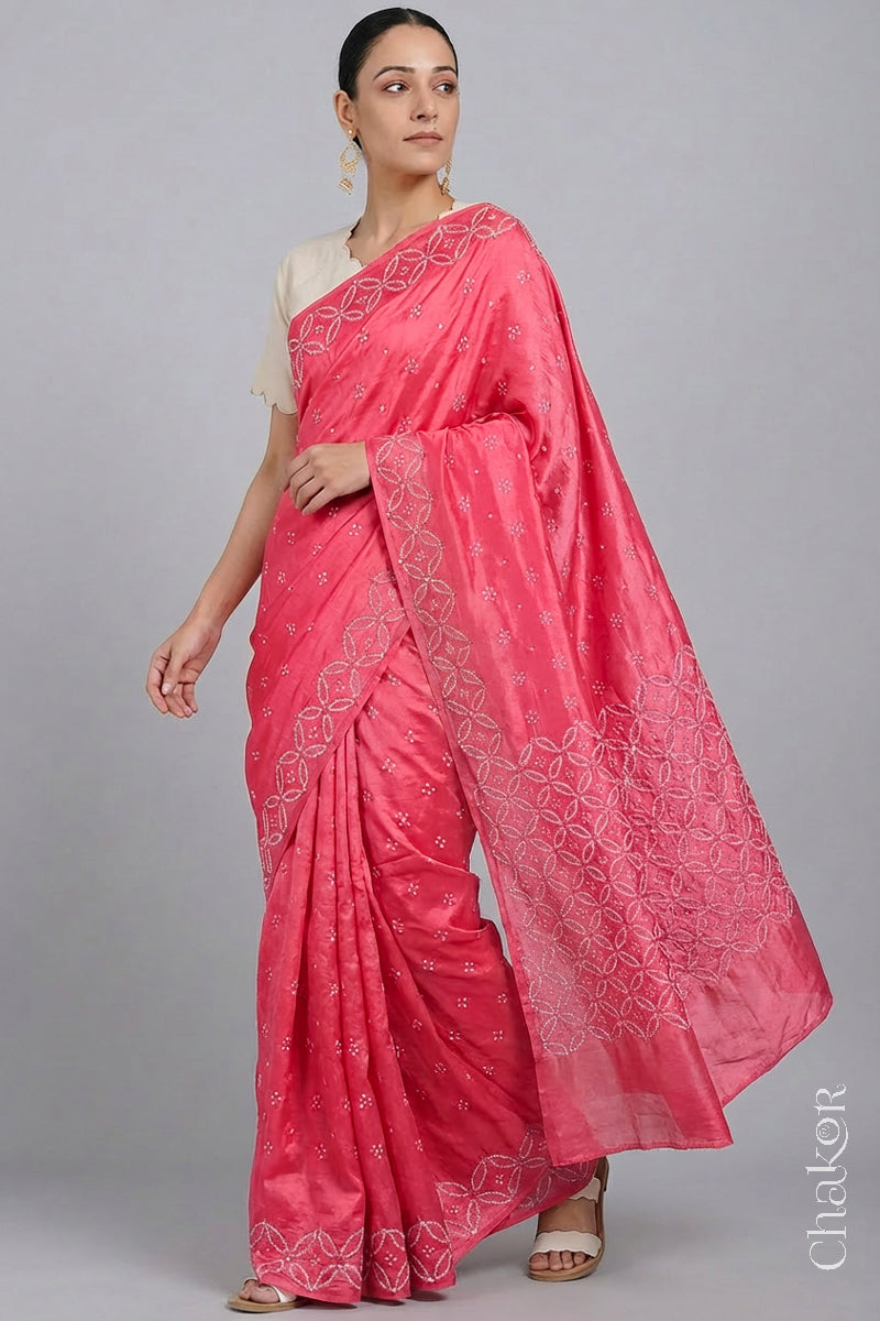 Model wearing Strawberry Pink Bandhani Mulberry Silk Saree with mirror embroidery.