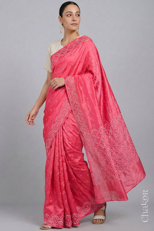Model wearing Strawberry Pink Bandhani Mulberry Silk Saree with mirror embroidery.