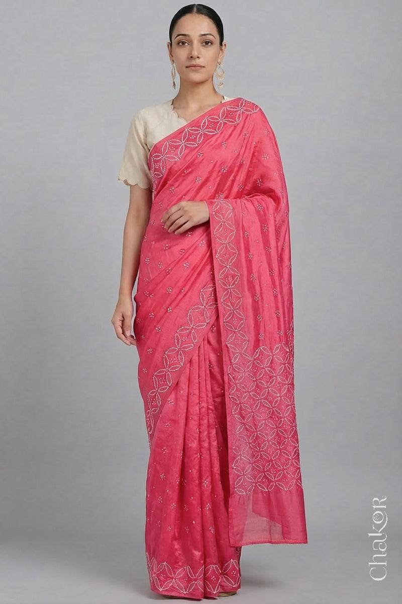 Model wearing Strawberry Pink Bandhani Mulberry Silk Saree with mirror embroidery.