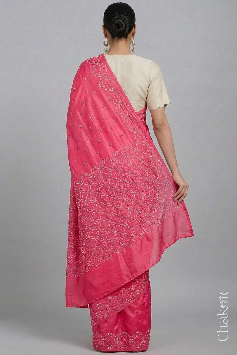 Back view of model wearing Strawberry Pink Bandhani Mulberry Silk Saree with mirror embroidery.