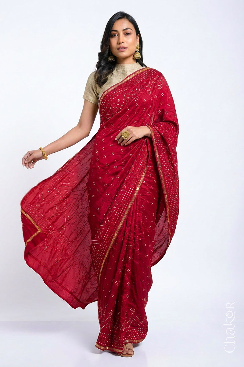 Model wearing Red Bandhani Mulberry Silk Saree with sequins embroidery.