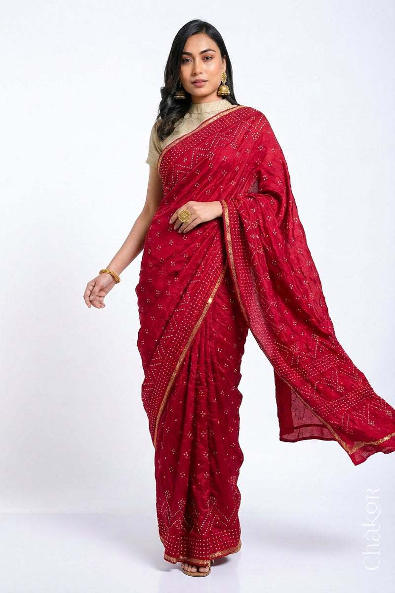 Model wearing Red Bandhani Mulberry Silk Saree, rai bandhej with sequins embroidery.