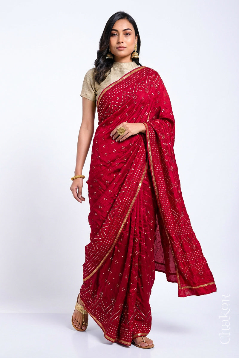 Model wearing Red Bandhani Mulberry Silk Saree, rai bandhej with sequins embroidery.