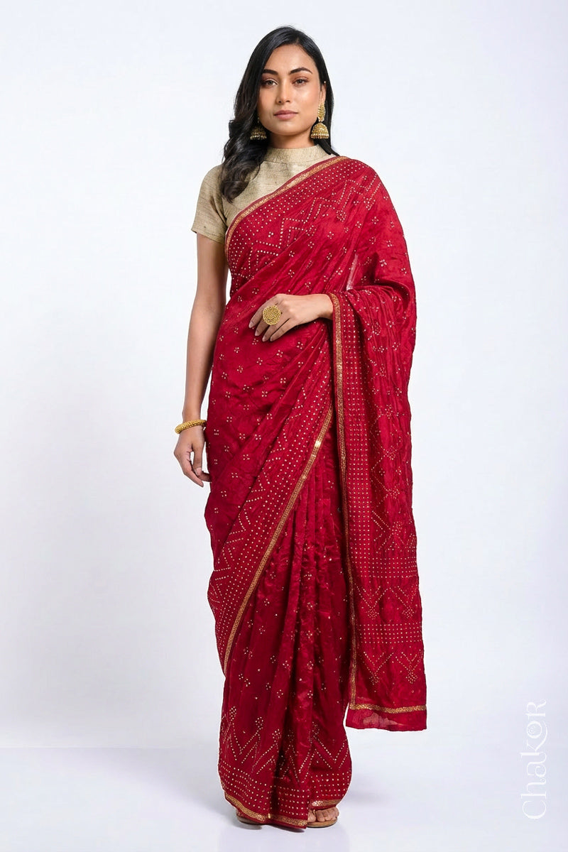 Model wearing Red Bandhani Mulberry Silk Saree, rai bandhej with sequins embroidery.